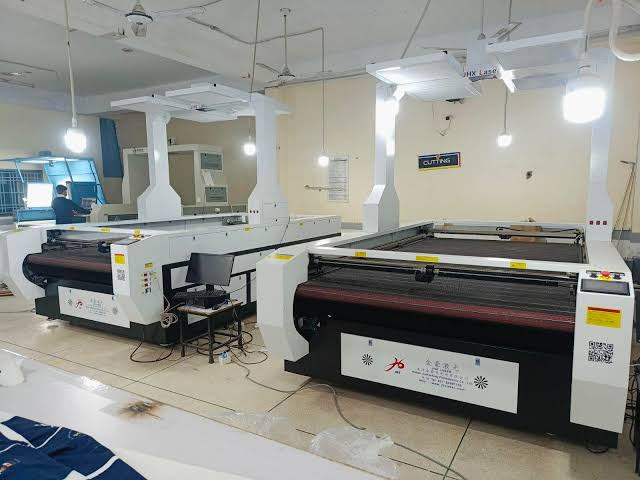 Automated fabric cutting machines in the production room