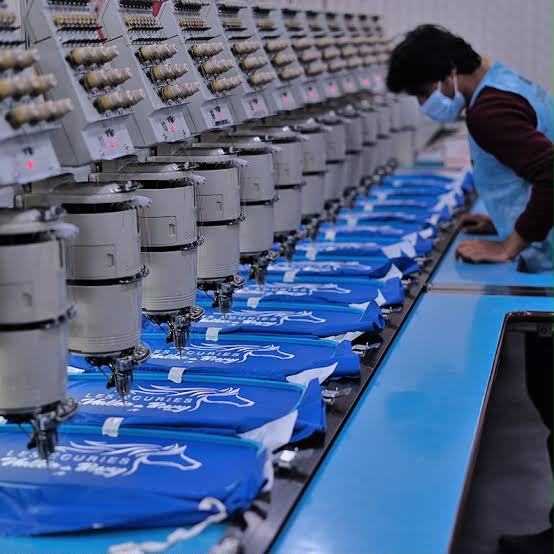 Production embroidery line stitching blue sportswear