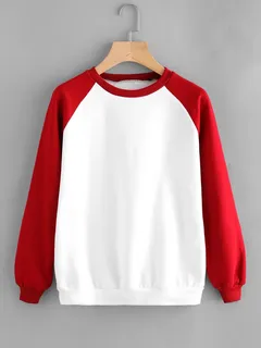 White crewneck sweatshirt with red raglan sleeves on a wooden hanger