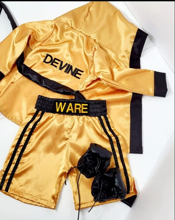 Gold satin kickboxing set with black trim and boxing gloves